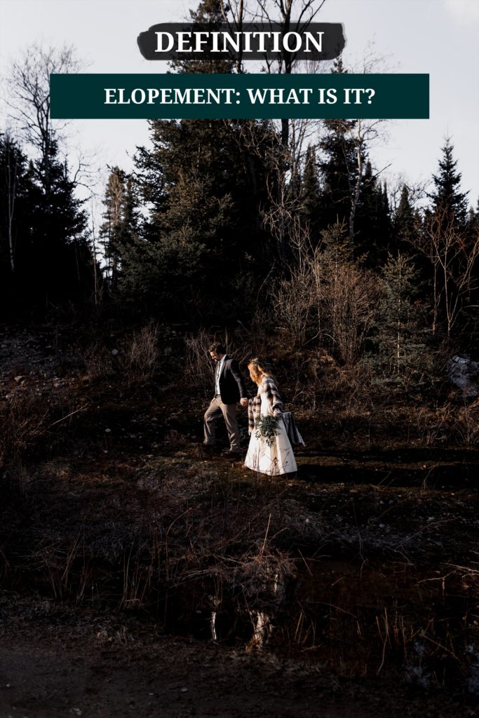 Cover of the blog article : Elopement, definition. What is an elopement, find the meaning and origin here. The image is about a couple walking hand in hand on their elopement day. It was a winter elopement in the mountain. There is still a bit of snow, and they walk among pine trees.